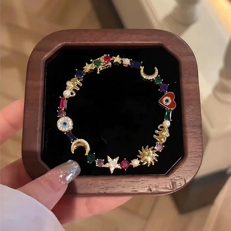 💫✨ Armband med himmelska symboler – sol, måne, stjärnor, flerfärgade kristaller